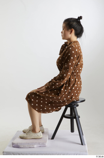 Aera  1 brown dots dress casual dressed sitting white…